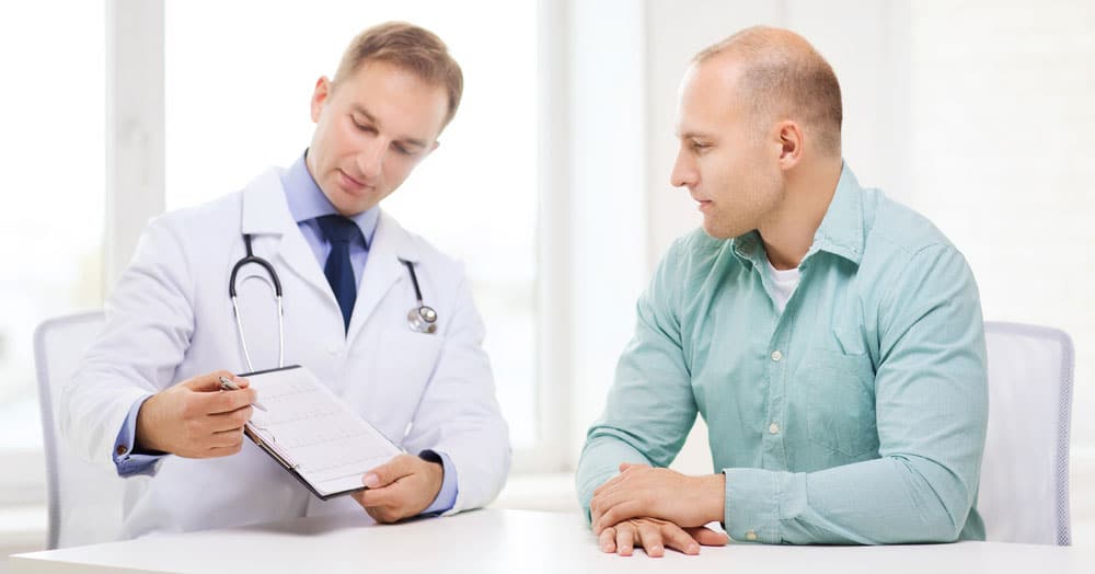 doctor and patient discussing bioidentical hormone replacement therapy cost