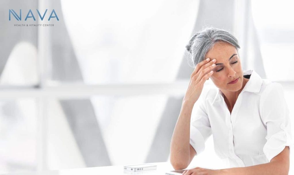 Woman visibly worried experiencing symptoms of sudden crashing fatigue in menopause