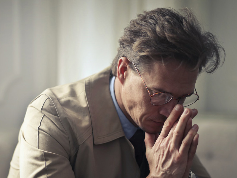 man looking thoughtful about hormone replacement therapy to treat erectile dysfunction