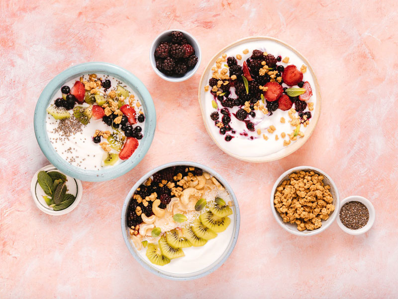 mixed fruits and nuts in bowls to illustrate a good acid reflux diet