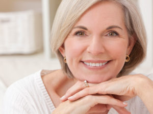 senior woman looking happy to illustrate good hormone therapy post hysterectomy