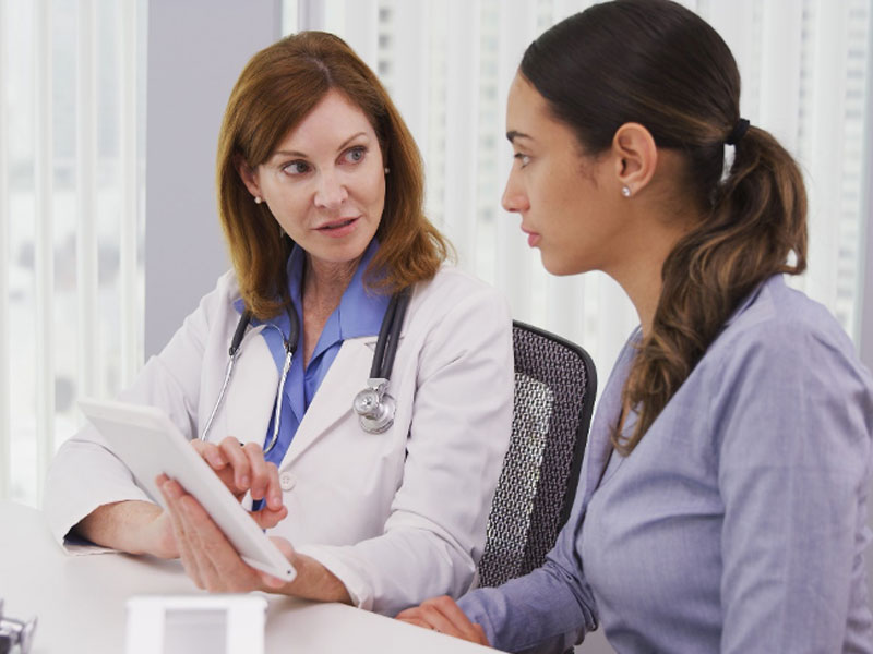 consultation between patient and doctor to illustrate advanced diagnostic testing