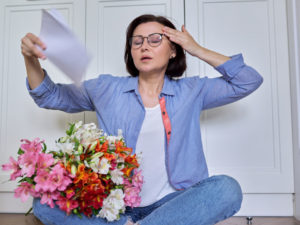 woman having hot flashes