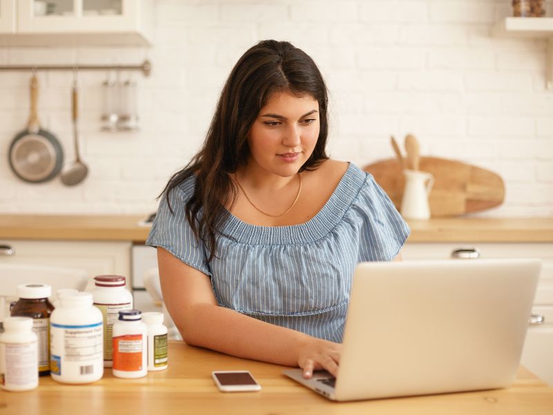 overweight young woman researching medical weight loss options