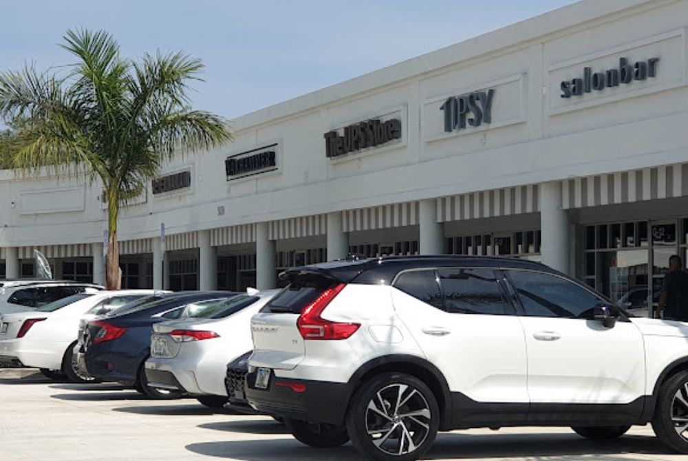 White cars parked outside of the Polo Club Shops in Boca Raton Florida