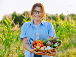 farmer with basket of food that's healthy for your gut microbiome