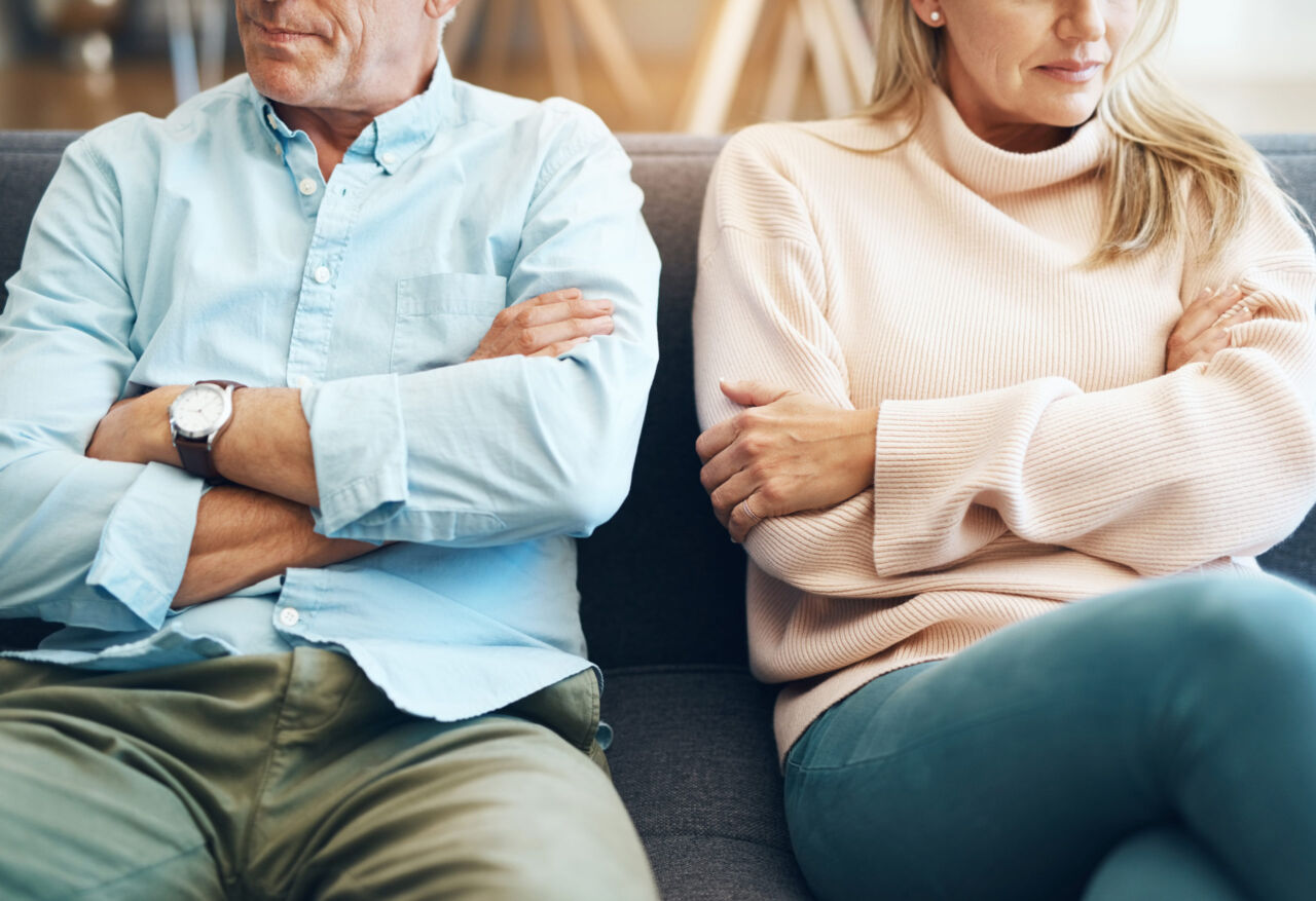 Divorce, fail and couple fight due to marriage problem, angry at home about family law and with conflict in a lounge. Anger, sad and people or partner frustrated due to infertility on a sofa
