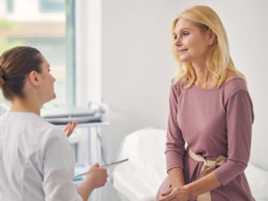 patient listening to doctor to learn about perimenopause