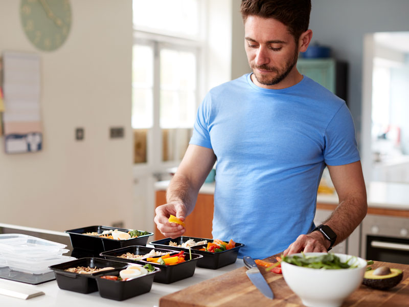 Man preparing home food to illustrate managing gut health and autoimmune disease integratively