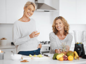 two women preparing a meal good for a perimenopause diet