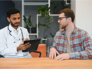 man consulting with his doctor about who should consider testosterone replacement