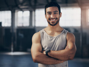 Muscular young man to illustrate benefits of testosterone replacement therapy TRT