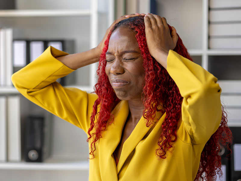 Woman who looks stressed, to illustrate worries about cortisol and weight gain