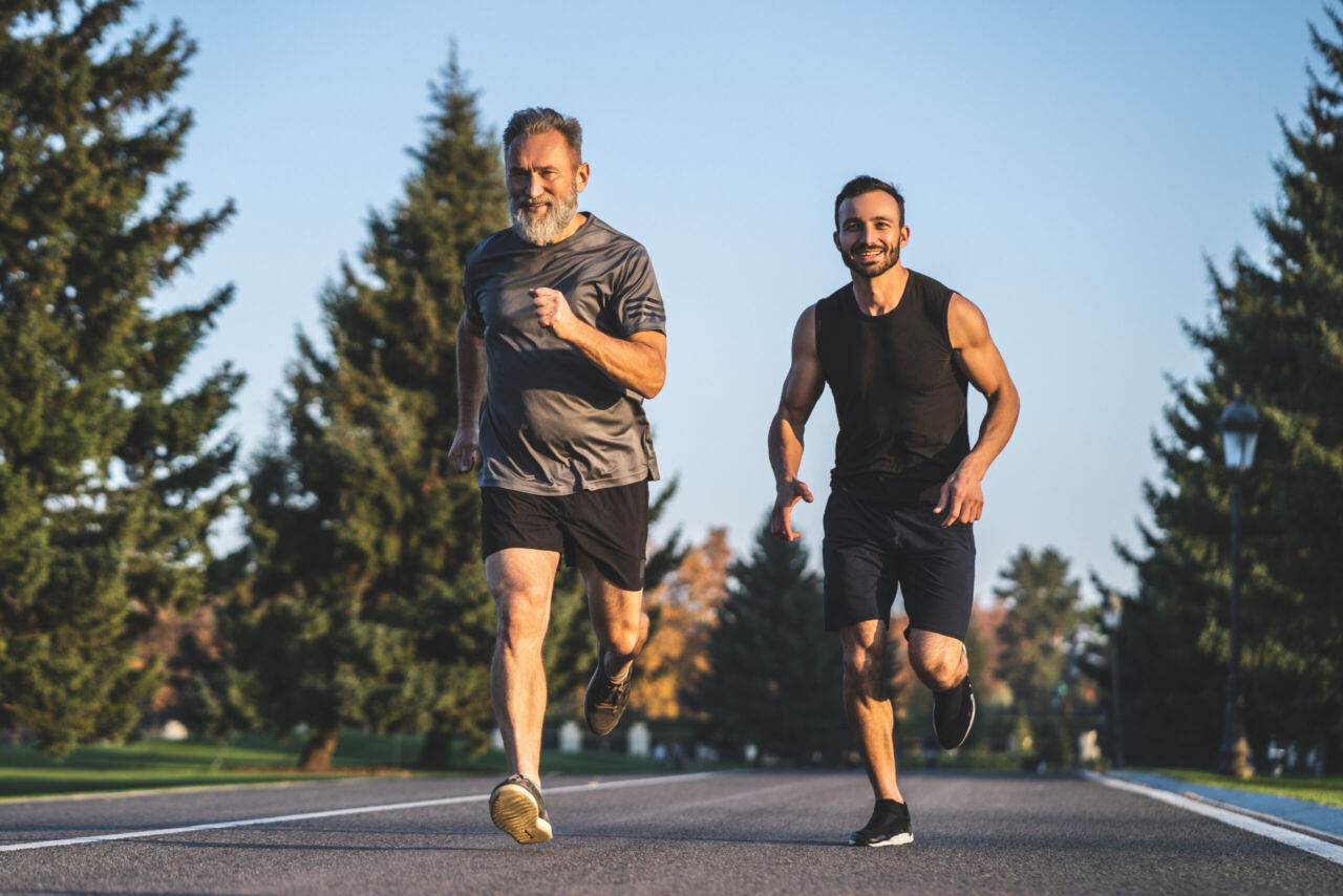 The father and a son running on the park road
