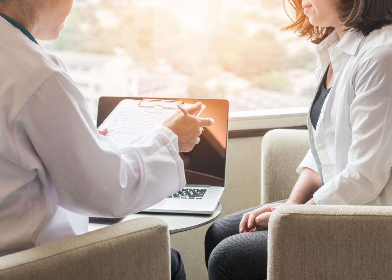Doctor (obstetrician, gynecologist or psychiatrist) consulting and diagnostic examining female patient's on woman’s obstetric-gynecological health in medical clinic hospital healthcare service