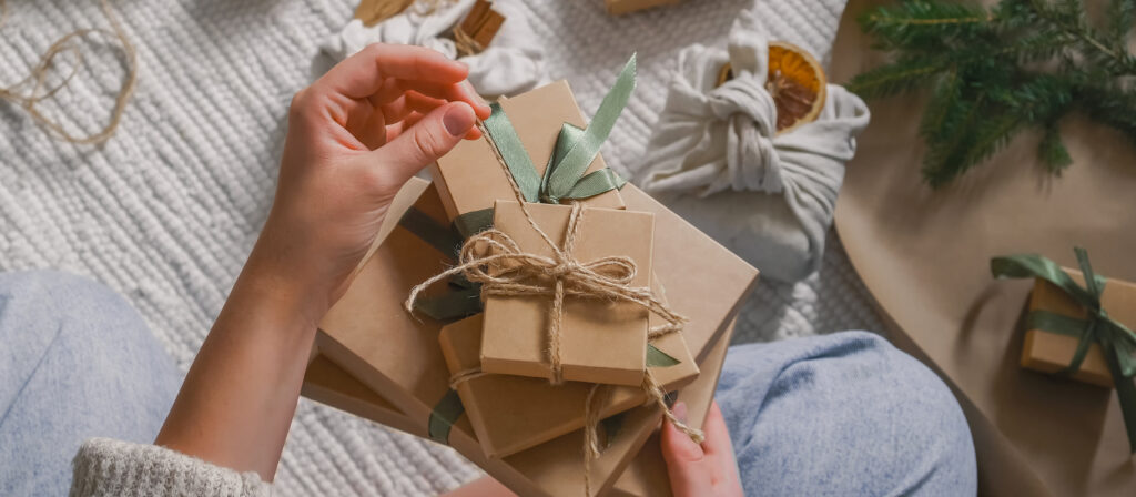 Christmas gift zero waste, eco friendly hand made box packaging gifts in kraft paper wooden table, eco christmas holiday concept, Christmas gift wrapping,eco decor banner